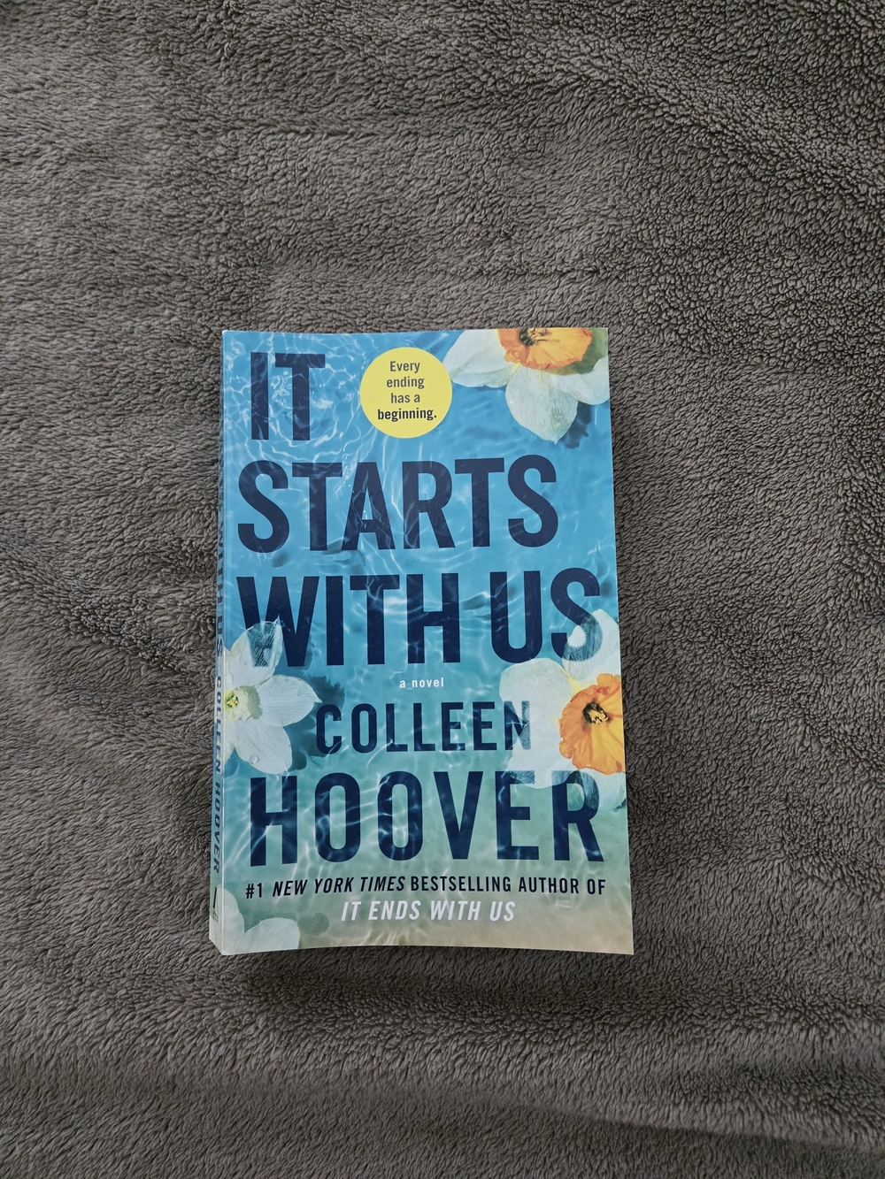 "It Starts With Us" Blue Floral Paperback Novel